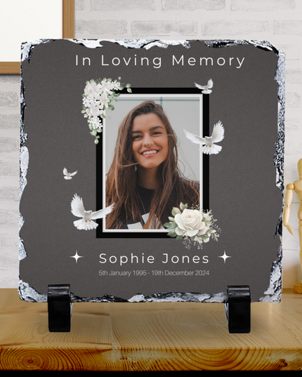 In Loving Memory Design photo slate with glossy finish featuring a framed portrait, white doves, floral accents, and personalized text.