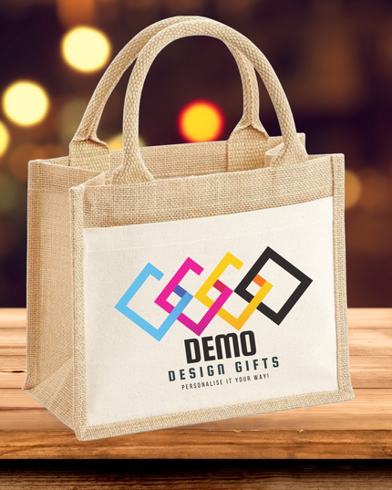 Branded white canvas tote bag with custom colorful logo on wooden table background