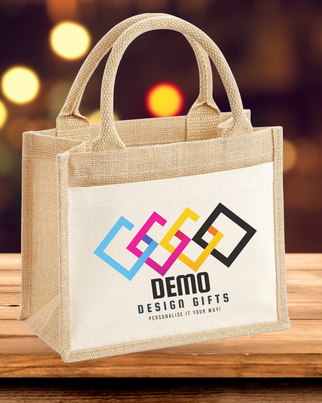 Branded white canvas tote bag with custom colorful logo on wooden table background